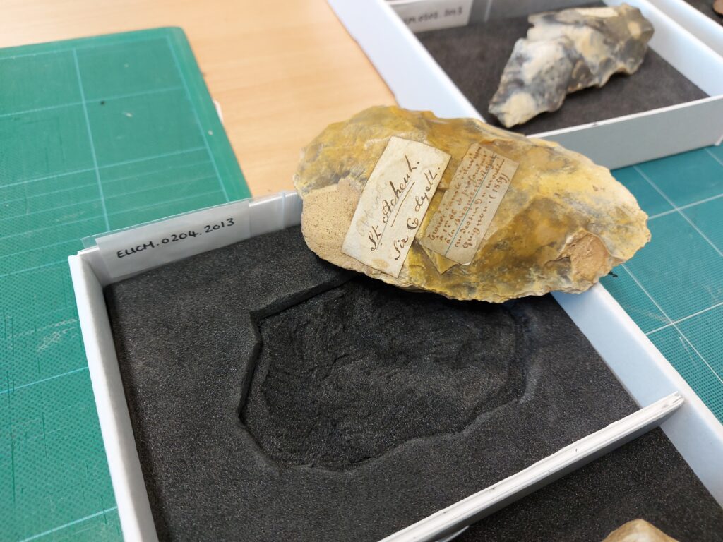 A stone edged out of its housing. The foam is carefully cut so the rock sits secure.