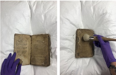 Two photographs of the cleaning of a small book with a brush. 