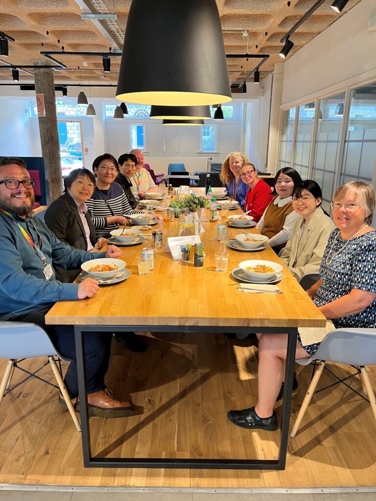 Staff and visitors eating lunch